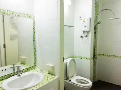 a bathroom with a sink and a toilet at Impact Arena Condo C1 by GoodRoom24 in Ban Song Hong