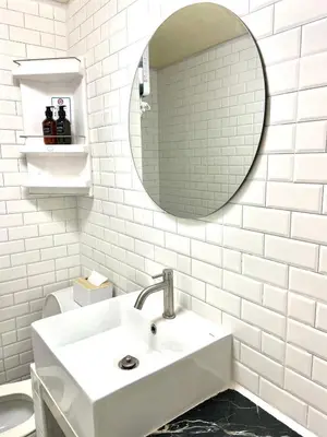 a white bathroom with a sink and a mirror at Impact Arena Condo C3 Grey by GoodRoom24 in Ban Bang Phang