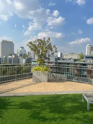 a park with a tree on top of a building at Executive Apartment Thonglor in Bangkok