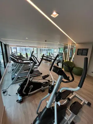 a gym with a bunch of exercise bikes in it at Cybiq Ratchada 32 By OBM in Ban Zong Katiam