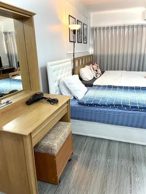 a room with two beds and a desk with a desk at Impact Arena C3 Twin Beds By GoodRoom 24 in Ban Bang Phang