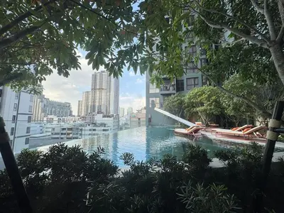 a swimming pool with a view of a city at Neon Cloud Bangkok in Bangkok