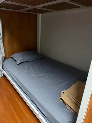 a bed in a small room with a mattress at Best Stay 394 homestay in Phra Khanong