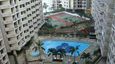 an overhead view of a swimming pool between two buildings at River View Bangkok in Bangkok