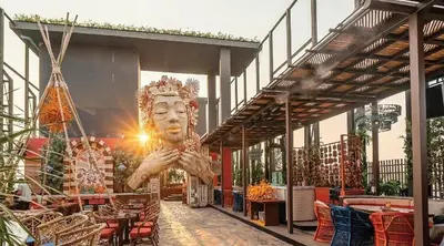 a large statue of a face on the side of a building at Spacious Serviced Apartment! in Bangkok