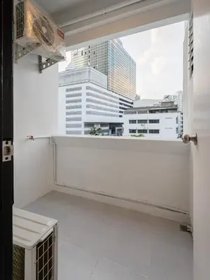 a room with a window with a view of a city at Silom Condominium in Bang Rak