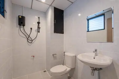 a bathroom with a toilet and a sink at Silom Condominium in Bang Rak