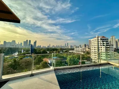 a view of the city from the balcony of a building at Cozy & Bright apartment - Asoke in Bangkok