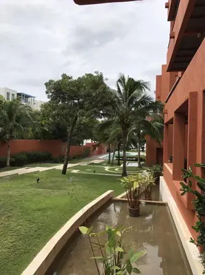 a garden view from a building with a pond at Beach front in Hua Hin Khao Tao in Ban O Pao
