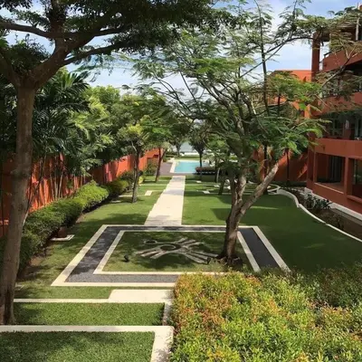 a view of a garden with trees and grass at Beach front in Hua Hin Khao Tao in Ban O Pao