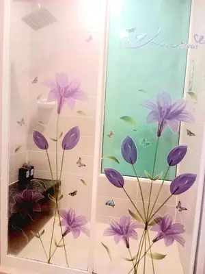 a window with purple flowers and butterflies on it at Free Airport Pick Up ! 12th Floor Cozy Studio Room, 5 mins walk to IconSiam & BTS in Bangkok