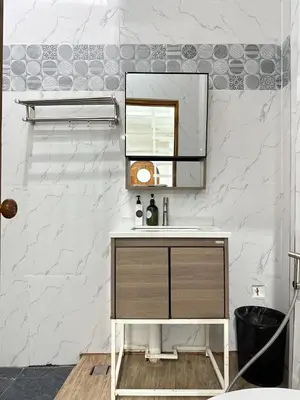 a bathroom with a sink and a mirror at Megun Room5 in Ban Bang Phlat