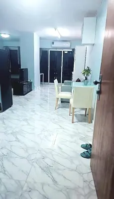 a living room with a marble floor and a table and chairs at River View Active 02 in Bangkok
