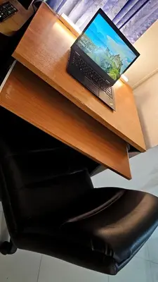 a laptop computer sitting on top of a desk at River View Active 02 in Bangkok
