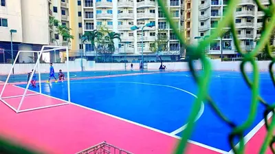 an empty basketball court in front of a building at River View Active 02 in Bangkok