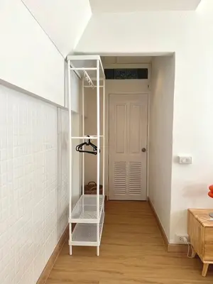 a room with a white closet with a white door at J House in Nonthaburi