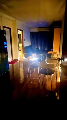 a room with chairs and a bed in a room at River View Active 7 in Bangkok