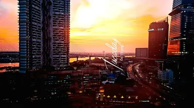 a view of a city skyline at sunset at River View Active 7 in Bangkok