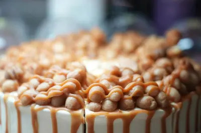a cake with nuts on top of it at Baan K Residence in Bangkok