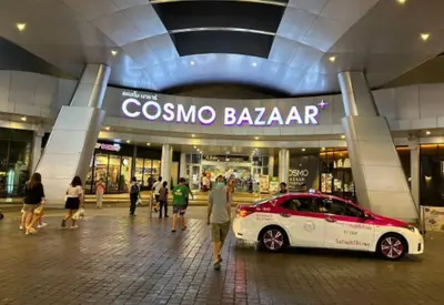 a car parked in front of a shopping mall at Popular Condo เมืองทองธานี in Thung Si Kan