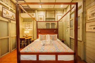 a bedroom with a bed with a dog on it at The Anonymous House in Bangkok
