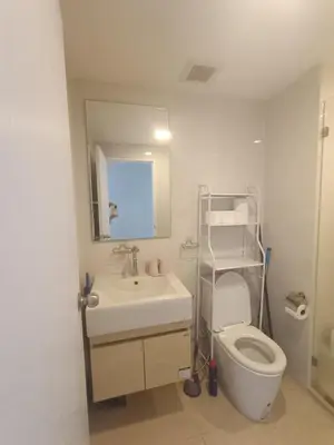 a bathroom with a sink and a toilet and a mirror at rama9\u533a\u57df\u5730\u94c1\u8c6a\u534e\u516c\u5bd3\u51fa\u79df Metro Luxe Ratchada in Bangkok