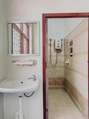 a bathroom with a sink and a shower at During Moonshine Stay in Bangkok