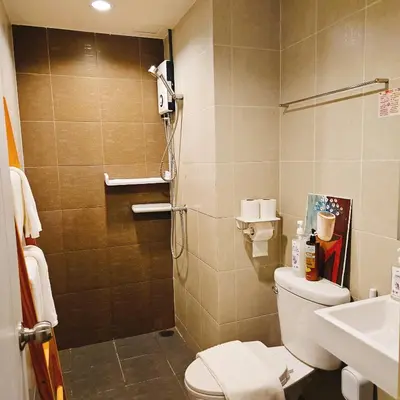 a bathroom with a shower and a toilet and a sink at 2BR - MRT Lak Song 5 Minute - Garden-Gym-Pool-wifi in Ban Khlong Khwang Klang