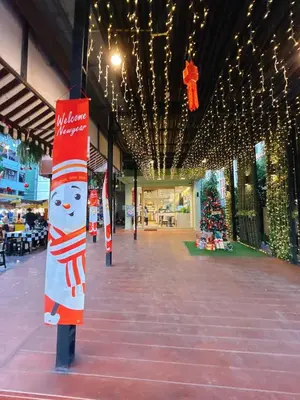 a hallway with a christmas tree and christmas lights at 2BR - MRT Lak Song 5 Minute - Garden-Gym-Pool-wifi in Ban Khlong Khwang Klang