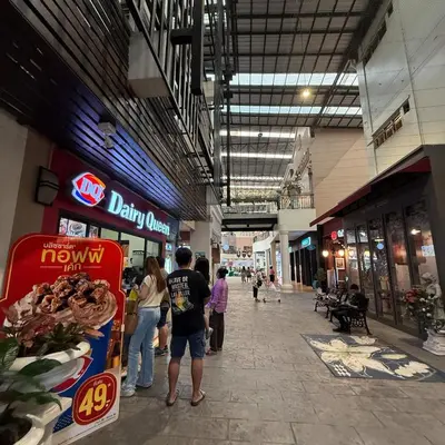 a group of people standing inside of a shopping mall at 2BR - MRT Lak Song 5 Minute - Garden-Gym-Pool-wifi in Ban Khlong Khwang Klang