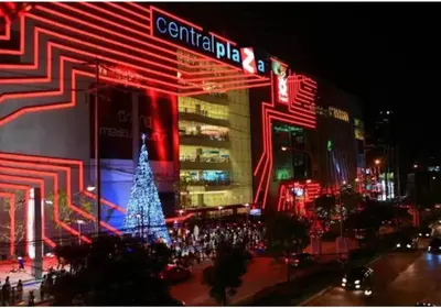a city lit up at night with a christmas tree at Studio16 at Changwattana in Ban Bang Phang