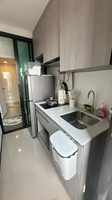 a small kitchen with a sink and a refrigerator at 1Bed Room Near Airport DMK BTS Swimming Pool Gym Monthly rental in Sathani Lak Si
