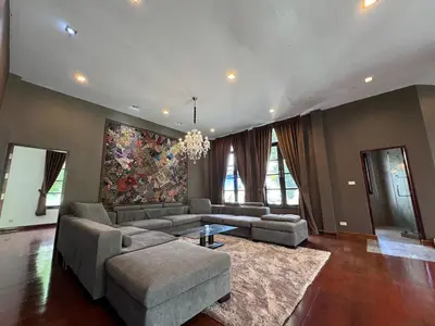 a large living room with a couch and a table at Tarzan DZ Bangkok Luxurious Villa in Sathani Ban Hua Mak