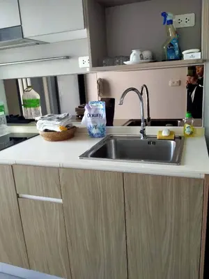 a kitchen with a sink and a counter top at Cybercarer Victoria St NSW 2011 Australia in Bangkok Yai