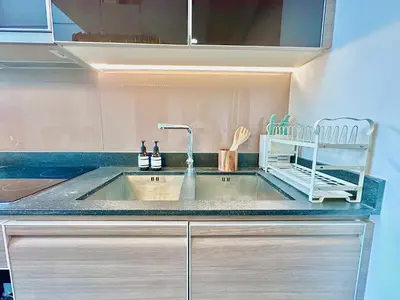 a kitchen sink with a faucet on a counter at Luxury 2Bed Duplex - 1min From Thonglor BTS in Bangkok
