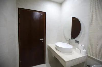 a bathroom with a sink and a mirror at Chic Ekkamai Escape Near BTS, Dining & Nightlife in Bangkok