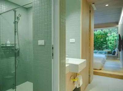 a bathroom with a sink and a shower at jasminespace in Khlong San
