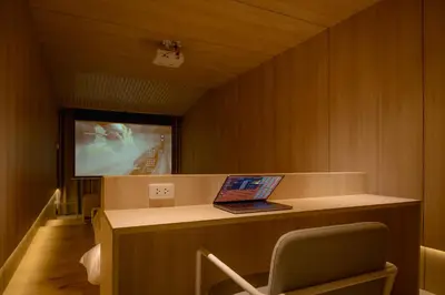 a room with a desk with a laptop on it at jasminespace in Khlong San