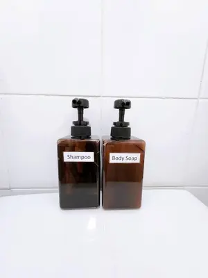 two bottles of soap sitting next to each other at 202-STP Homely room Free Wi-Fi and Near BTS in Sathani Bang Khen