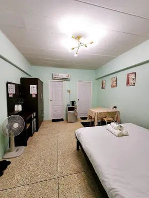 a bedroom with a bed and a table in it at 202-STP Homely room Free Wi-Fi and Near BTS in Sathani Bang Khen