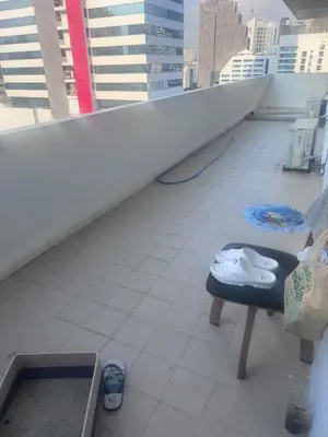 a balcony with a pair of toilets on a ledge at Surawong Condominium in Bangkok