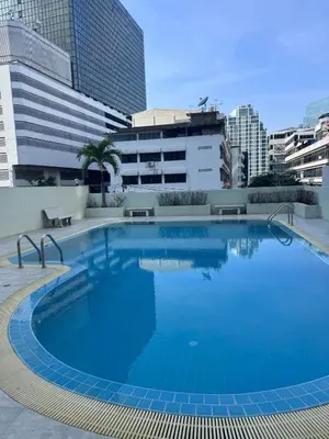 a large swimming pool on top of a building at Surawong Condominium in Bangkok