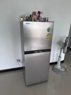a stainless steel refrigerator in a kitchen at Surawong Condominium in Bangkok