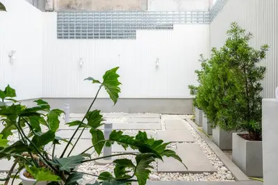 a courtyard with plants in a building at Vaeh Viean Silom in Bangkok