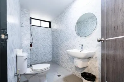 a bathroom with a white toilet and a sink at xx Yellow Place Sukhumvit Soi 2 -เยลโล เพลส สุขุมวิทซอย 2 in Bangkok