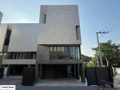 a building with a stone facade at Luxury Home Office Srinakarin in Lat Krabang