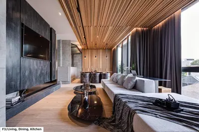 a living room with a couch and a television at Luxury Home Office Srinakarin in Lat Krabang