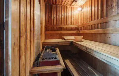 an empty wooden sauna with a bench in it at Spacious and Renovated 1-Bedroom 100m to Nana BTS - 55 sqm in Bangkok