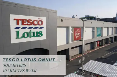 a building with a tesco lotus on it at Sukhumvit 81 Haven House- BTS Onnut in Bangkok