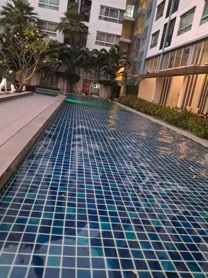 a swimming pool in the middle of a building at MRT SaiMa D condo monthly rent in Ban Sai Ma